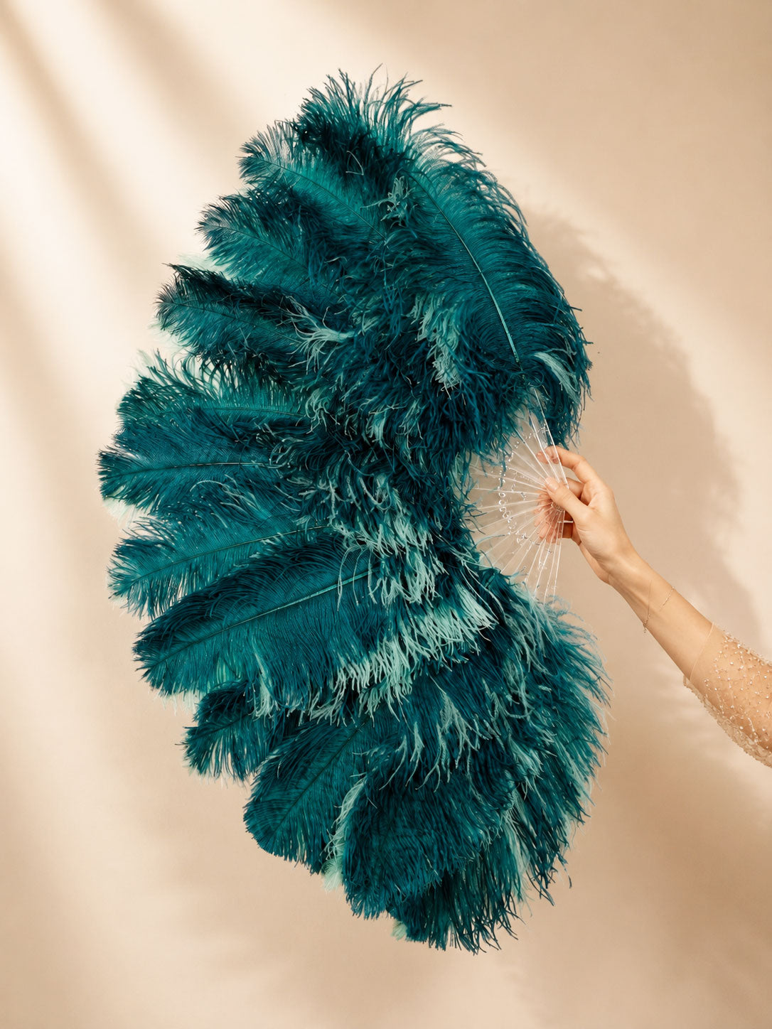 Side view of BurlyLuxe Single Layer Beginner's Double-Sided Stage Ostrich Feather Fan 25" × 47".