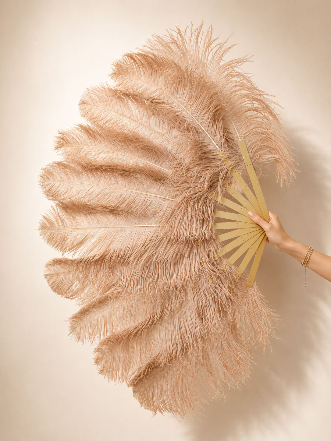 Close-up of BurlyLuxe Natural Single Layer Ostrich Feather Fan showing feather texture and fan shape.