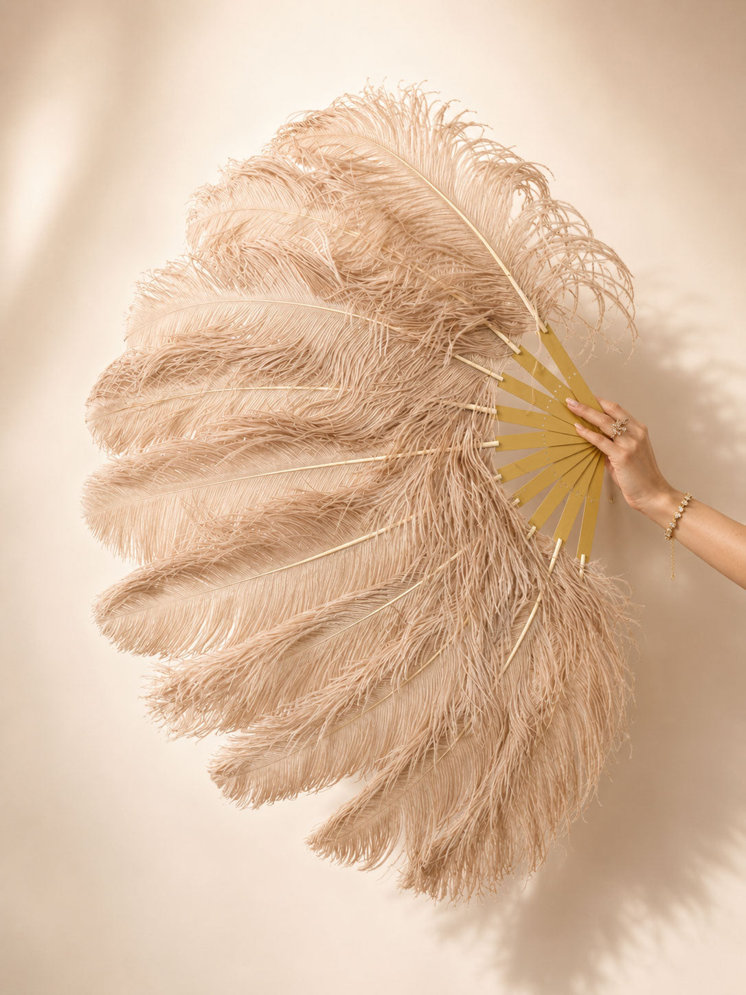 Side view of BurlyLuxe Natural Single Layer Ostrich Feather Fan.